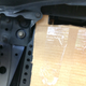 A little precision grinding with a carbide burr fixed the clearance issue here. I think just a straight piece of strap will work for mounting at the top corner here.